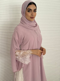 Classic lavender pink abaya with smooth crepe and sheer lace. Making it an exquisite choice for Eid, Weddings and morning formal events.