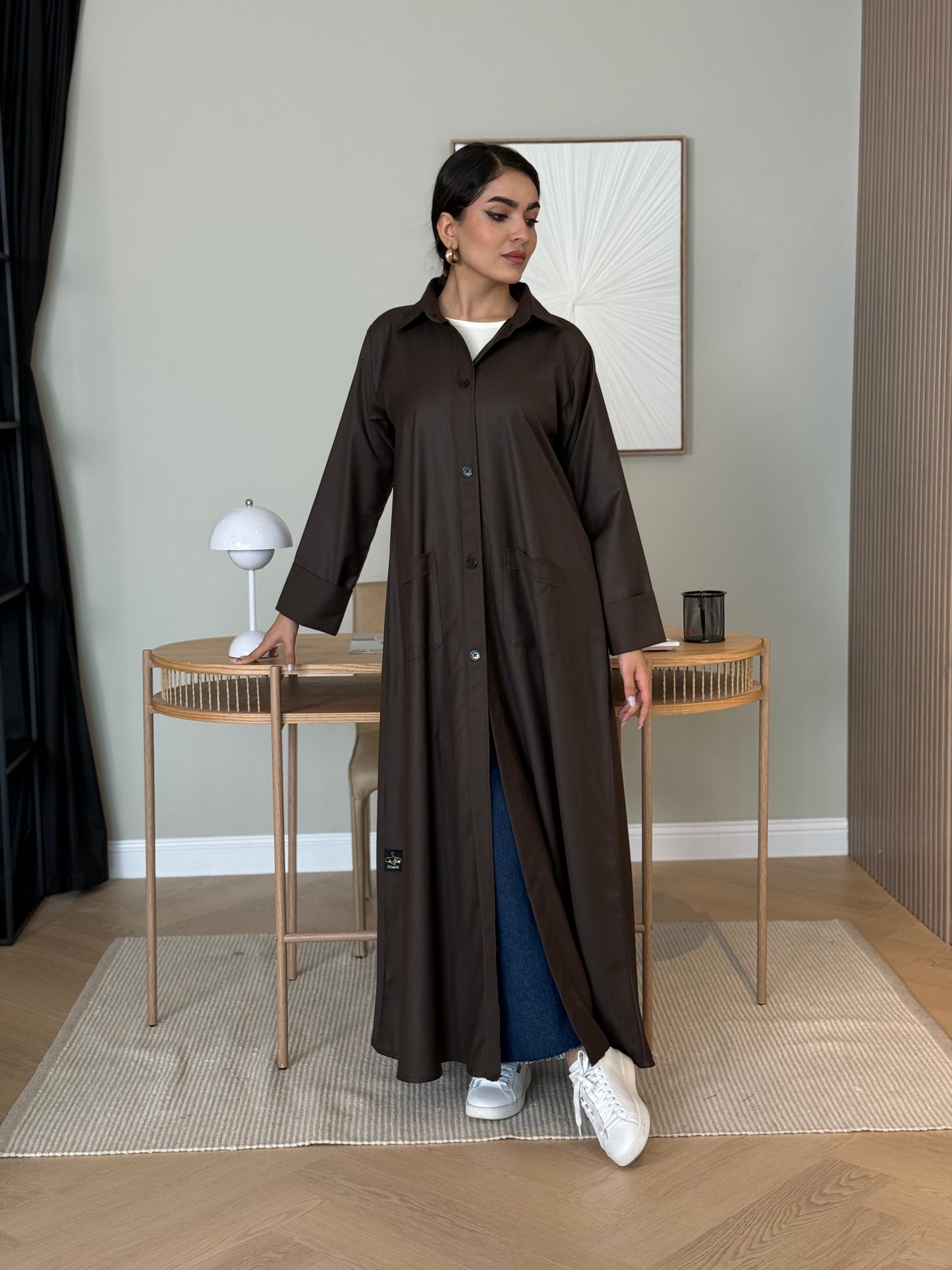 A dark brown linen abaya with smart collar and practical pockets, a perfect choice for office wear and everyday wear.