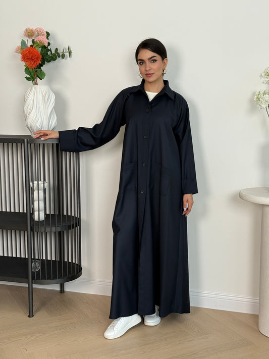 A navy blue linen abaya with smart collar and practical pockets, a perfect choice for office wear and everyday wear.