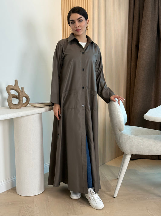 An oud brown linen abaya with smart collar and practical pockets, a perfect choice for office wear and everyday wear.
