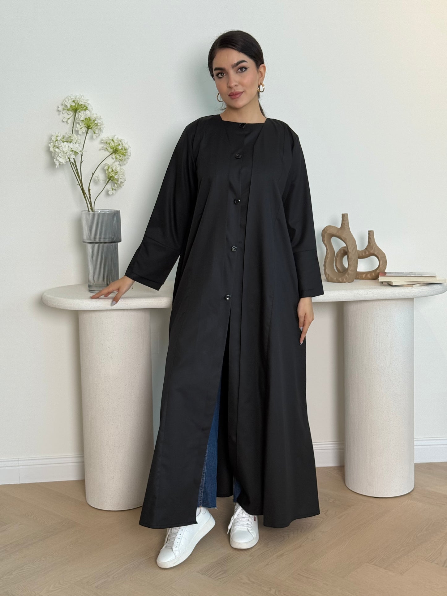 A black linen abaya with button-down front, a perfect choice for office wear and everyday wear.