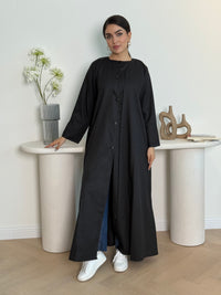 A black linen abaya with button-down front, a perfect choice for office wear and everyday wear.