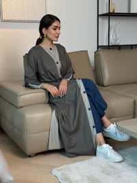 A dark grey linen abaya with button-down front, a perfect choice for office wear, university and everyday wear.