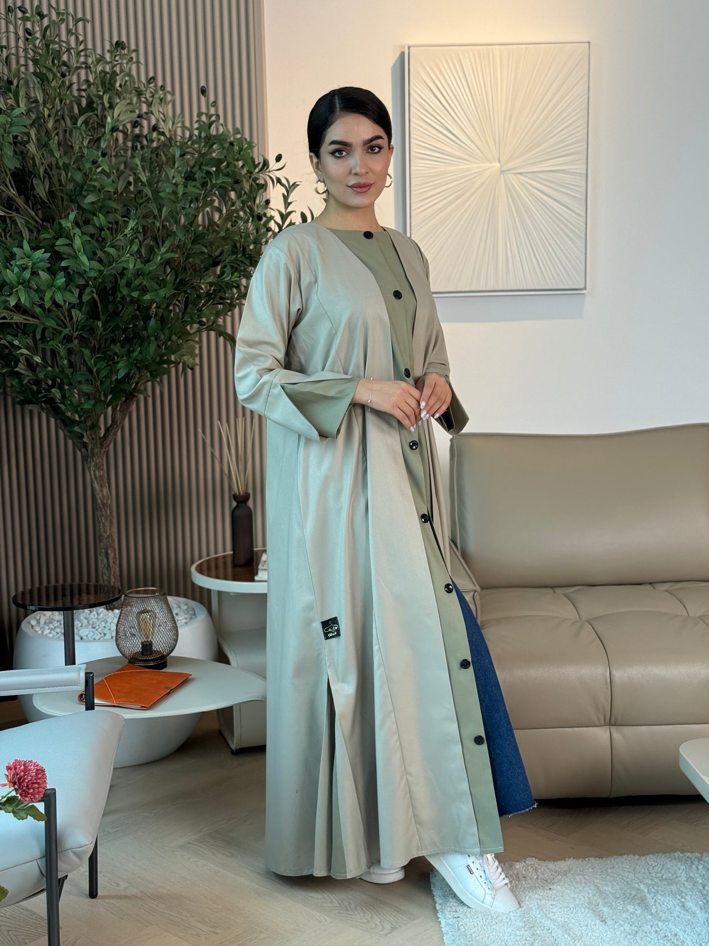 A light sage linen abaya with button-down front, a perfect choice for office wear and everyday wear.