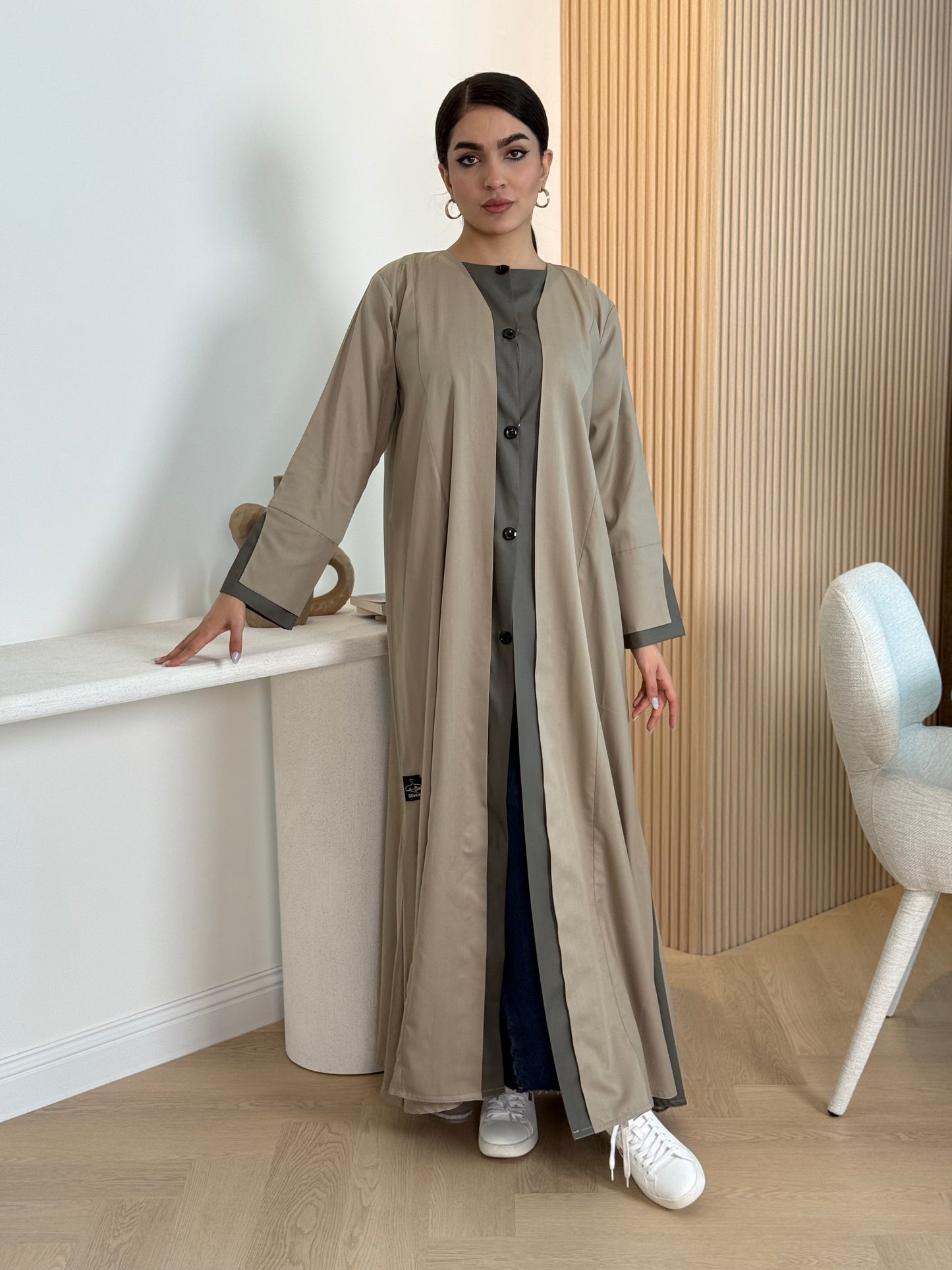 A sand beige linen abaya with button-down front, a perfect choice for office wear and everyday wear.