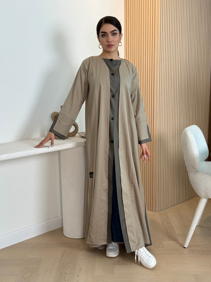 A sand beige linen abaya with button-down front, a perfect choice for office wear and everyday wear.