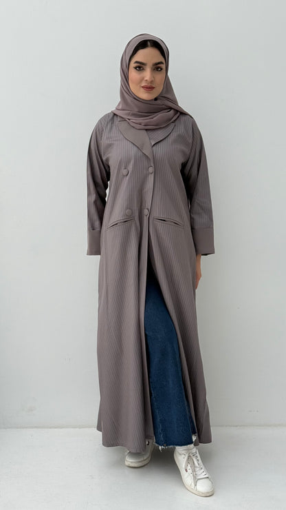 Woman wearing a long Ash Brown Pinstripe Linen Coat Abaya and a matching sheila on a white background