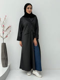 Woman wearing a Black Pinstripe Linen Coat Abaya with a white background