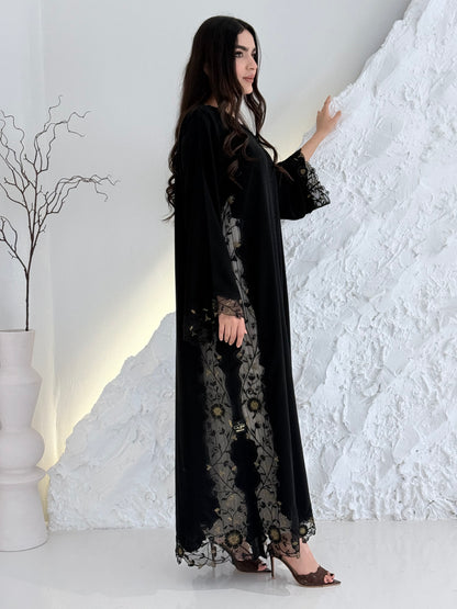 Person wearing a Premium Gold Hand-Embellished Abaya made from Nida fabric and Sheer Mesh Panel outfit on a white background