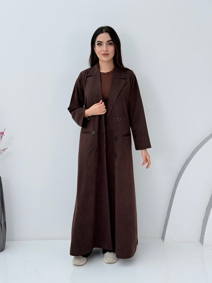 Woman wearing a Premium dark brown Shamwa coat abaya against a white background