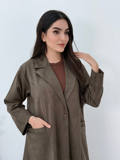 Woman wearing a Premium dark olive Shamwa Coat Abaya on a white background
