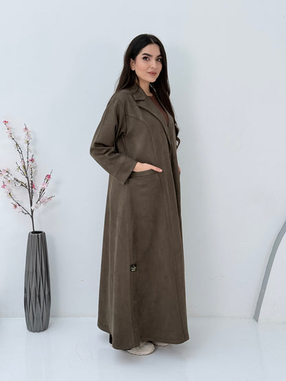 Woman wearing a Premium dark olive Shamwa Coat Abaya on a white background