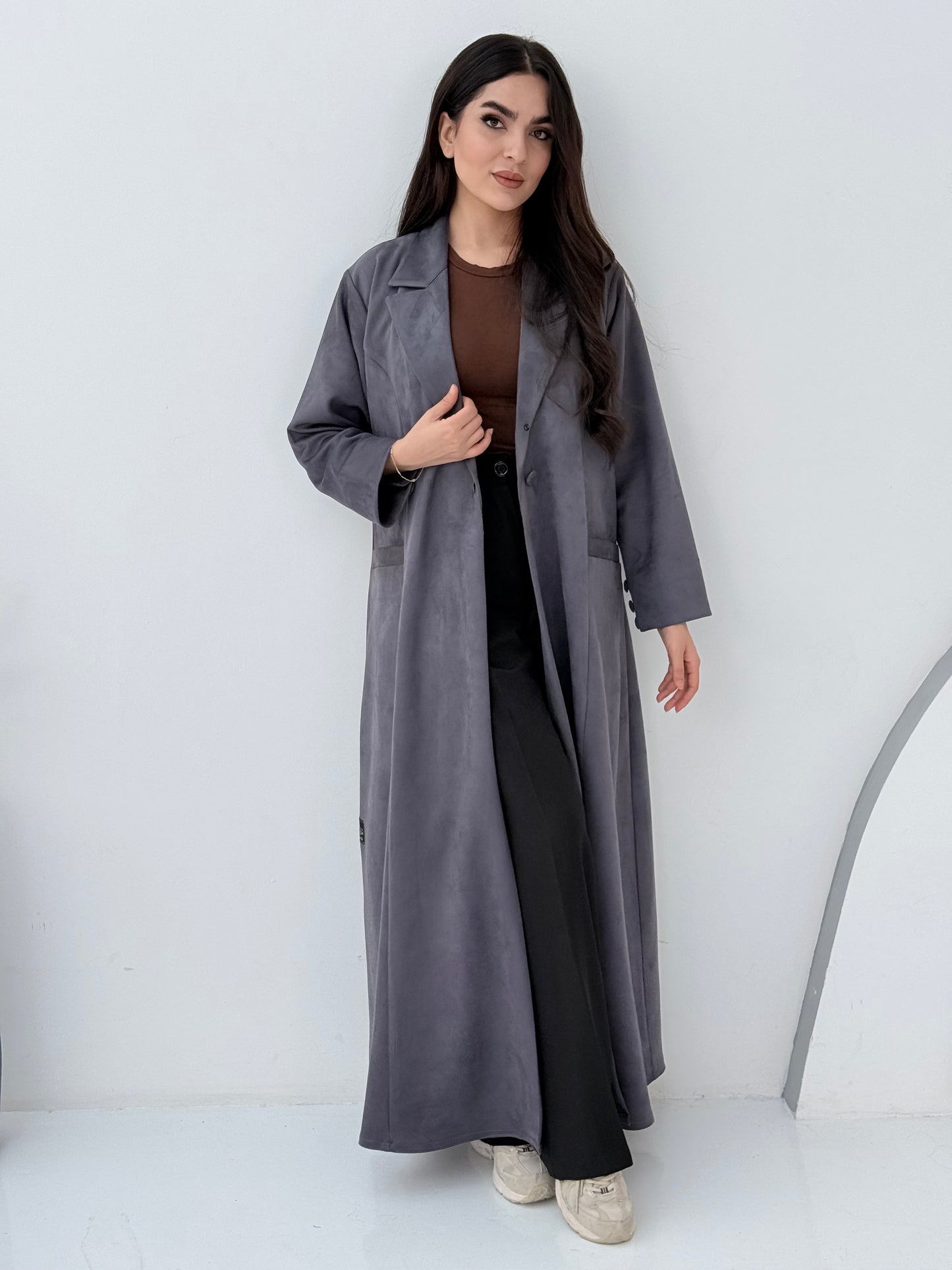 Woman wearing a Premium steel grey Shamwa Coat Abaya on a white background