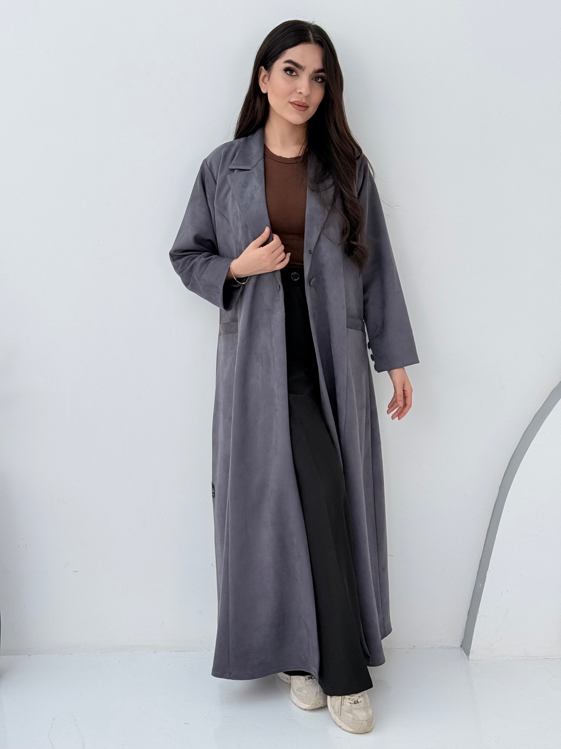 Woman wearing a Premium steel grey Shamwa Coat Abaya on a white background