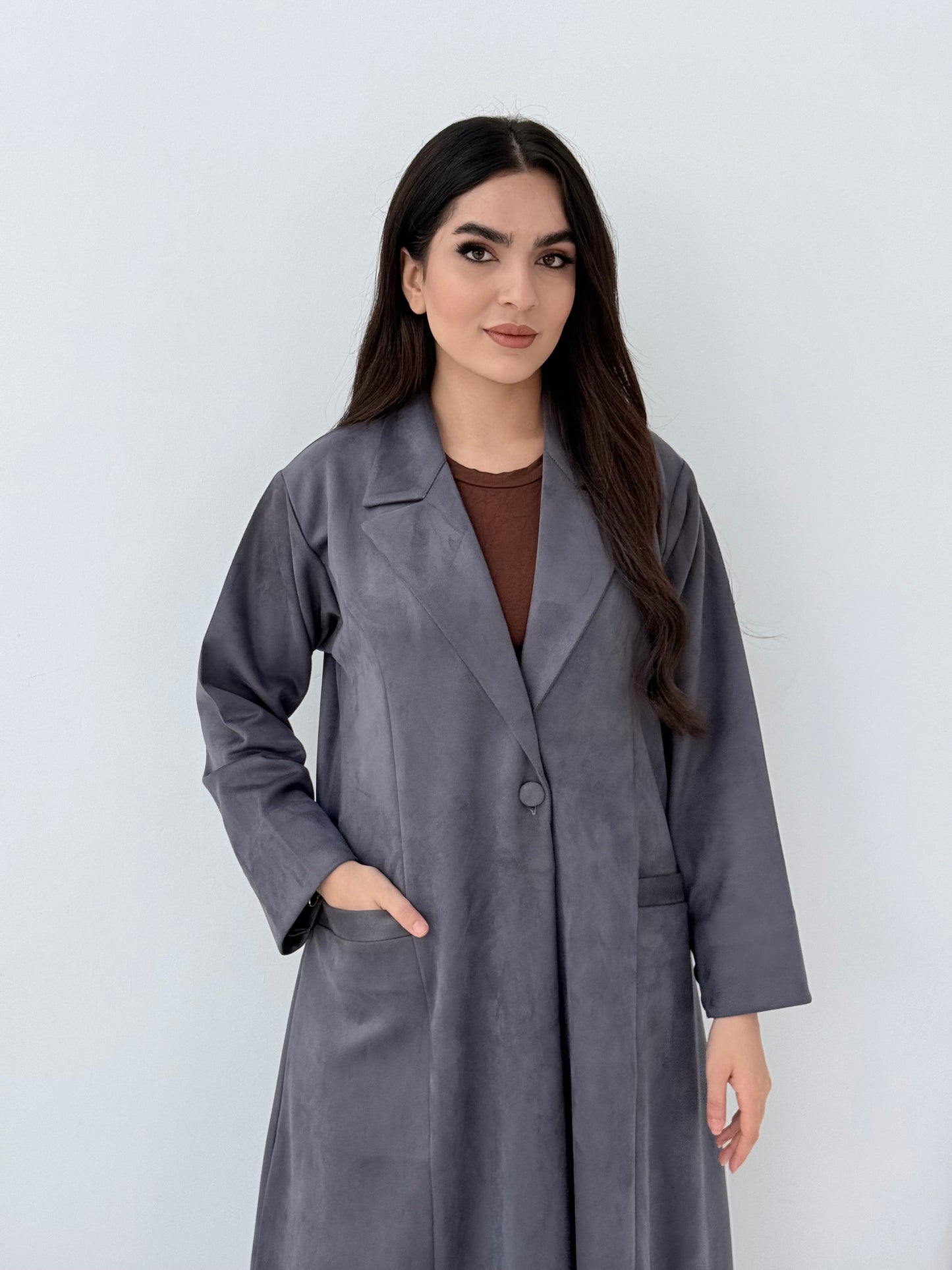Woman wearing a Premium steel grey Shamwa Coat Abaya on a white background