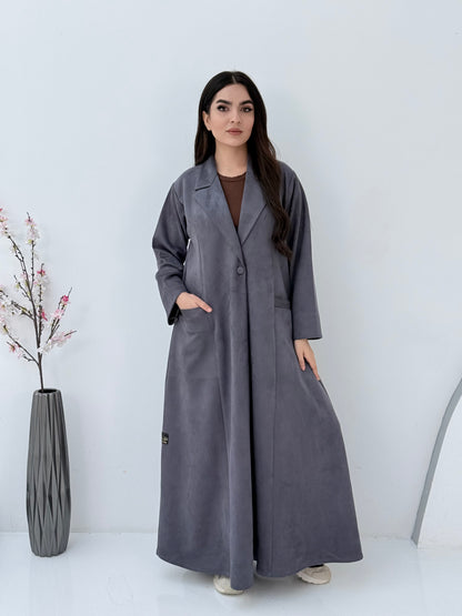 Woman wearing a Premium steel grey Shamwa Coat Abaya on a white background