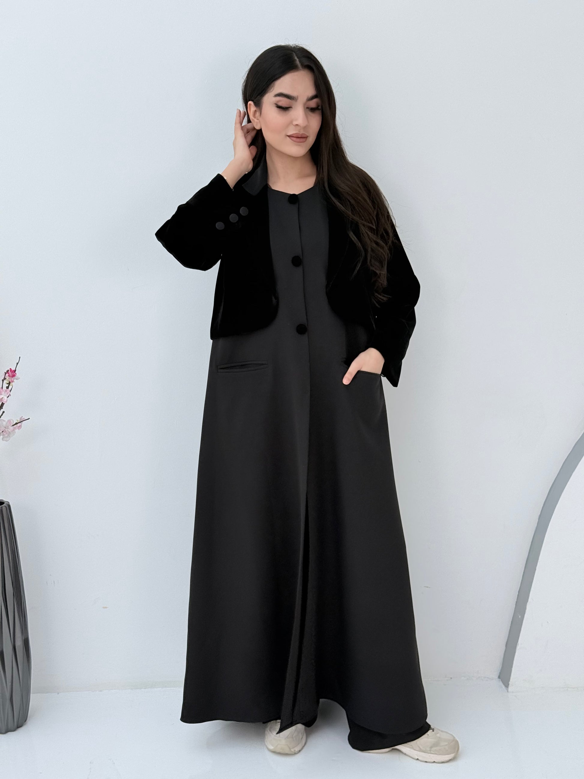 Person wearing a Black Dual-Texture Abaya on a white background