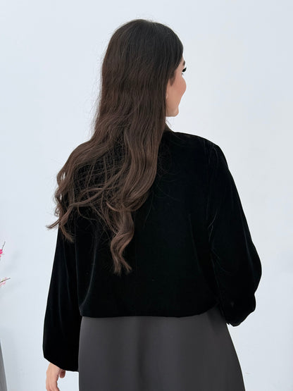 Person wearing a Black Dual-Texture Abaya on a white background