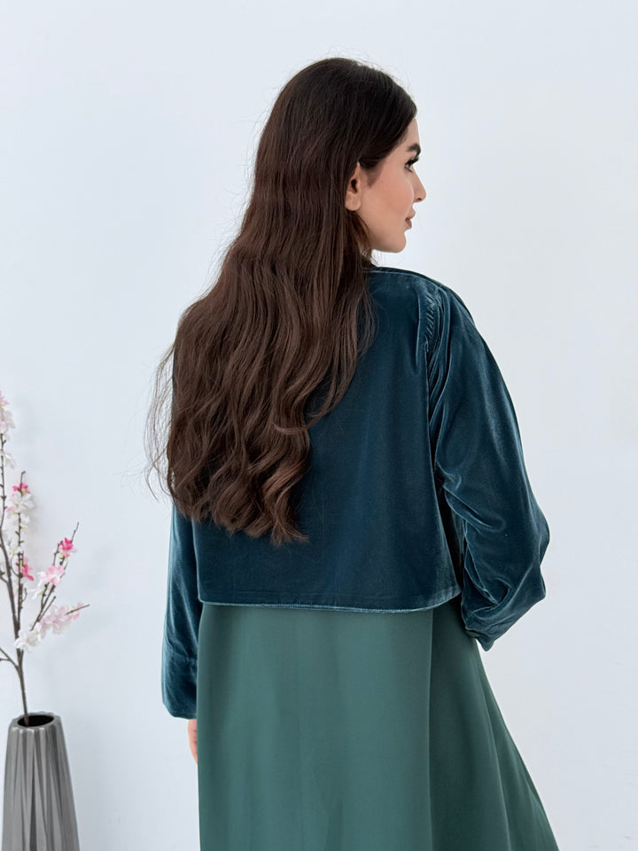 Woman wearing a long Emerald Green Dual-Texture Abaya with a matching jacket against a white background