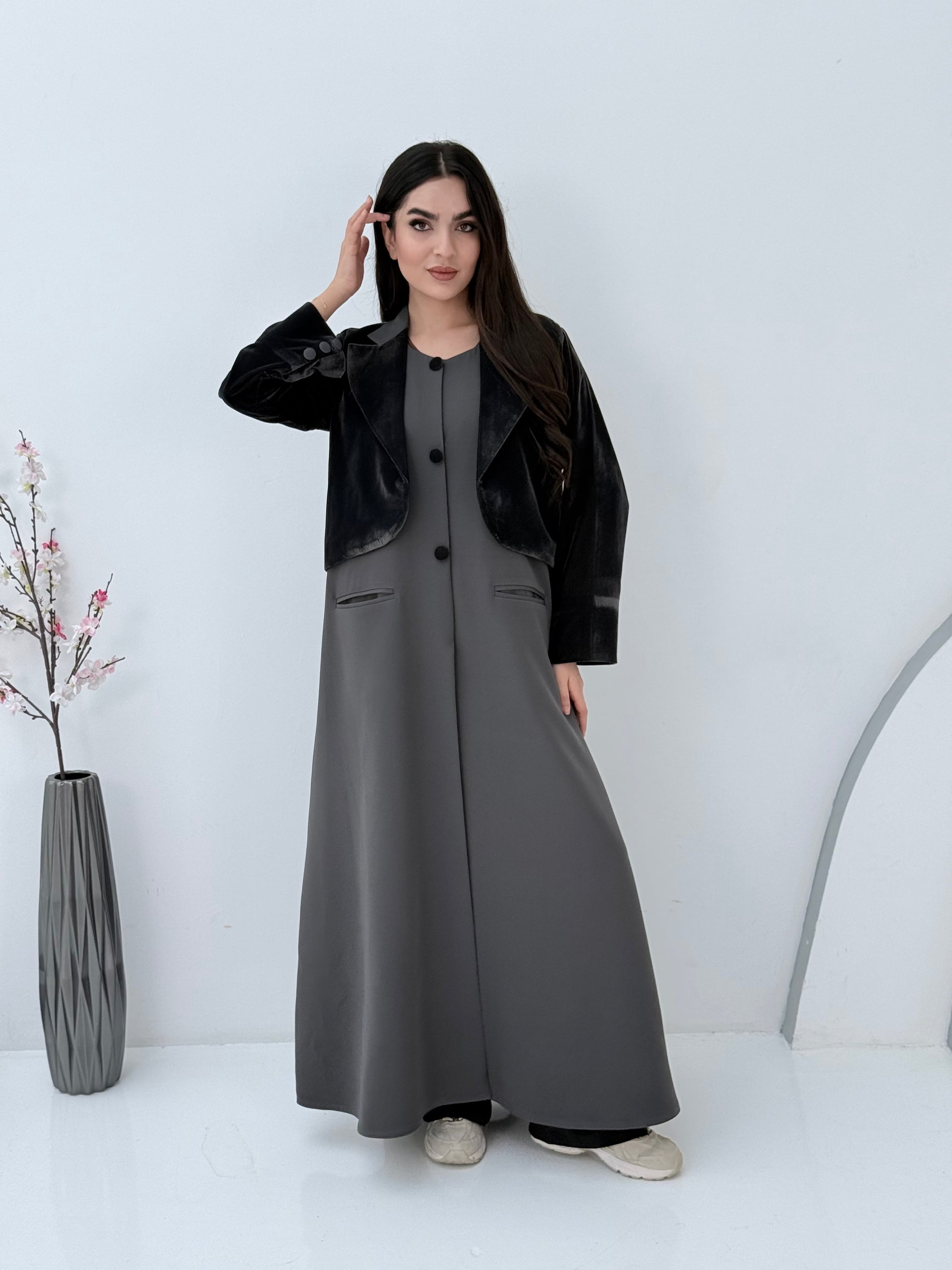 Person wearing a light grey Dual-Texture Abaya on a white background