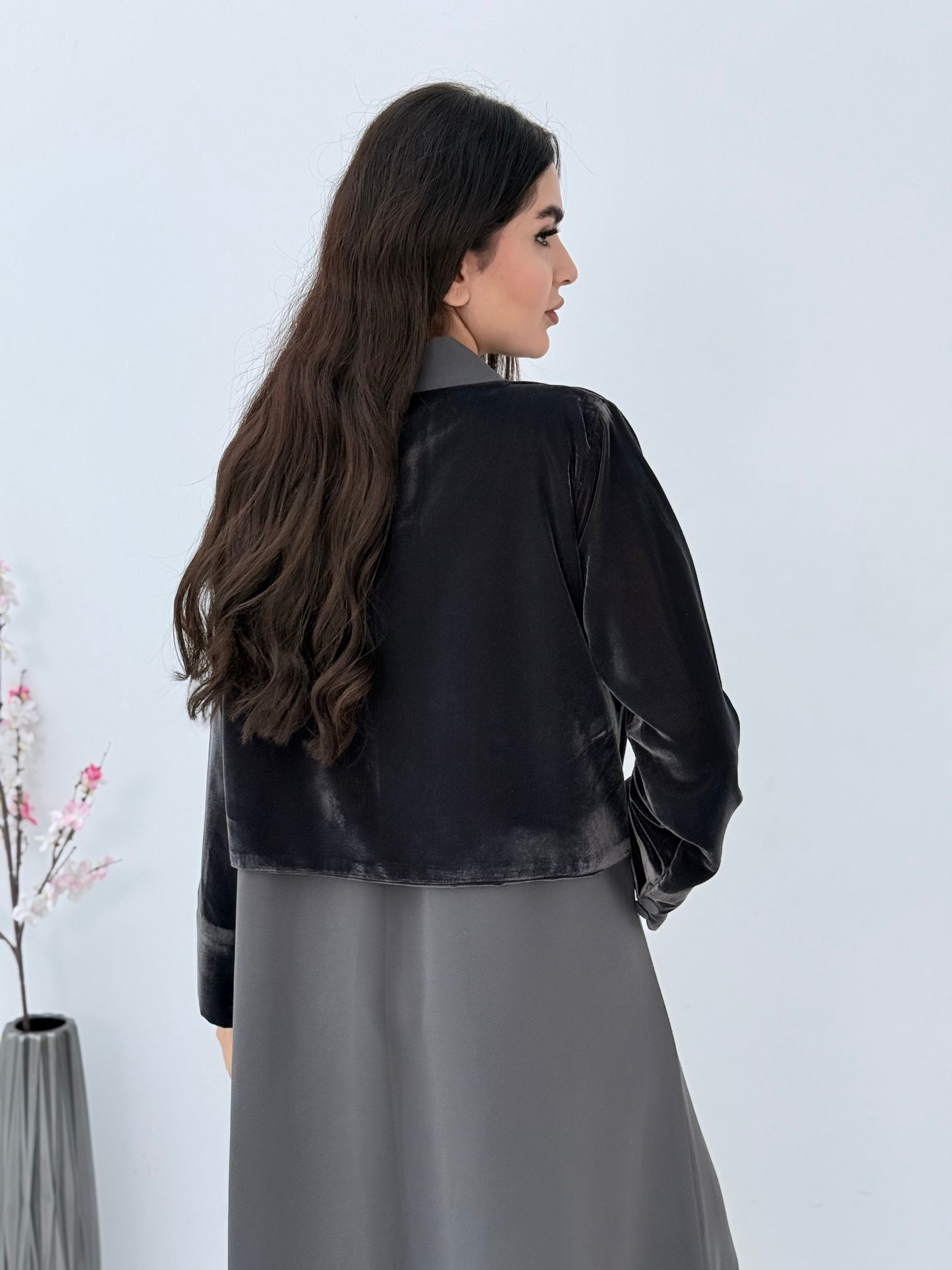Person wearing a light grey Dual-Texture Abaya on a white background