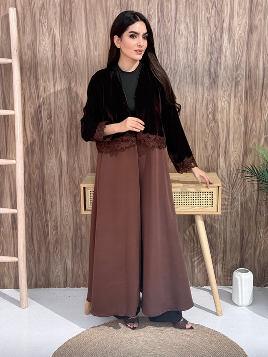 Woman in a Premium brown velvet Crepe and Velvet abaya on a wooden background