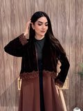 Woman in a Premium brown velvet Crepe and Velvet abaya on a wooden background