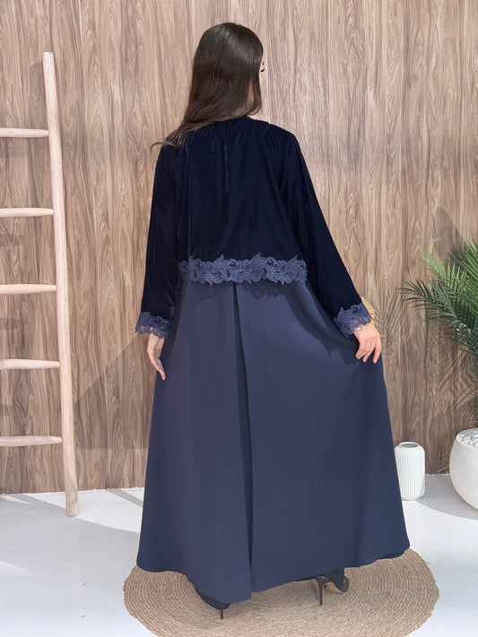 Woman in a Premium navy blue velvet Crepe and Velvet abaya on a wooden background