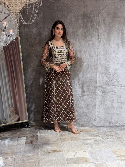 Woman in a luxury Dark Brown Embroidered Tulle kaftan Dress with Stone Detailing standing on a marble floor