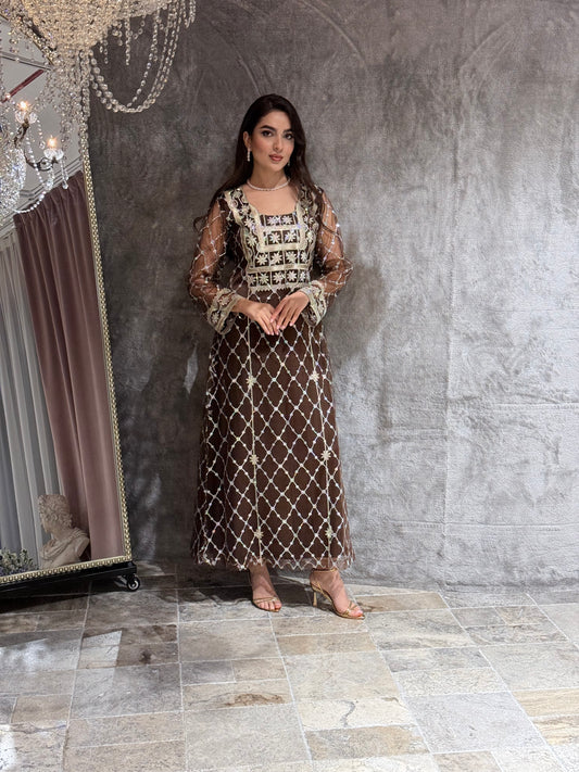 Woman in a luxury Dark Brown Embroidered Tulle kaftan Dress with Stone Detailing standing on a marble floor