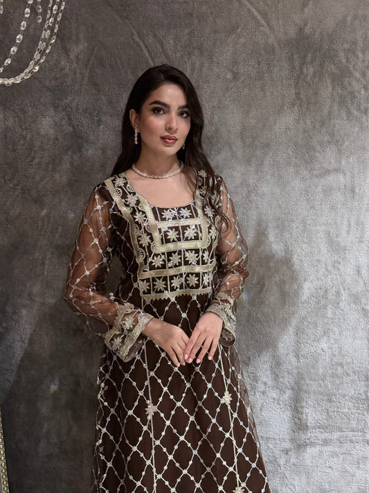 Woman in a luxury Dark Brown Embroidered Tulle kaftan Dress with Stone Detailing standing on a marble floor