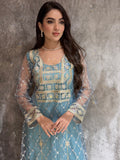 Woman in a luxury tiffany blue Embroidered Tulle kaftan Dress with Stone Detailing standing on a marble floor