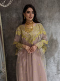 Woman in a Light Purple Embroidered Tulle kaftan  Dress on a textured surface