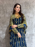 Woman wearing a Navy Blue Luxury Embroidered Kaftan Dress on a gray background