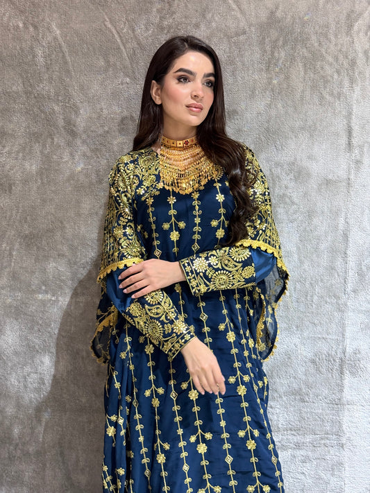 Woman wearing a Navy Blue Luxury Embroidered Kaftan Dress on a gray background