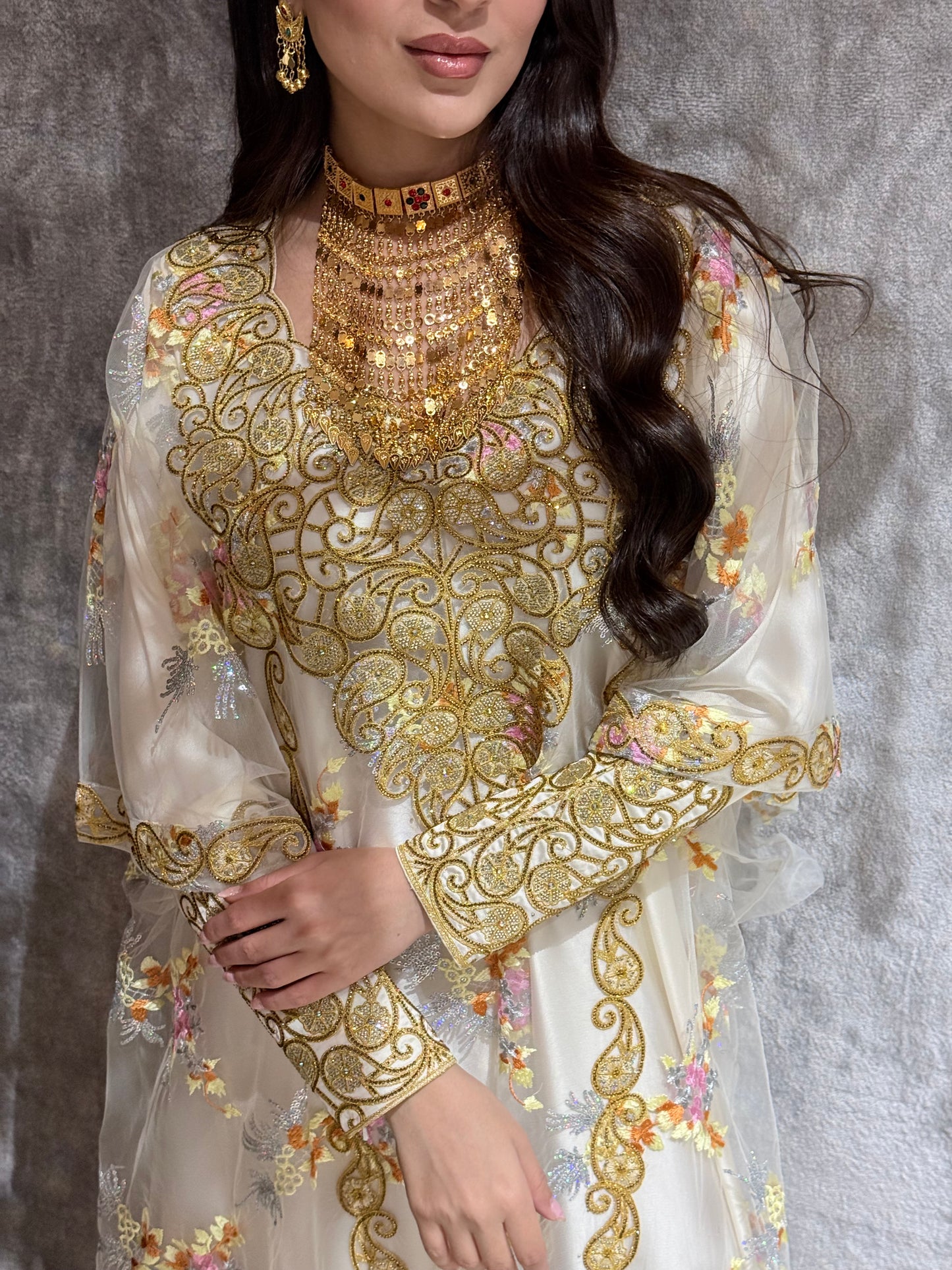 Woman in a Off-White Luxury Floral Kaftan dress standing on a marble floor.