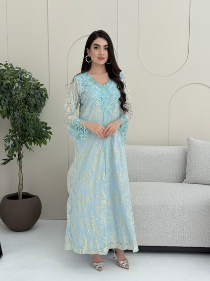 A woman wearing a baby blue floral lace kaftan, perfect for Eid, luxury occasions and parties.