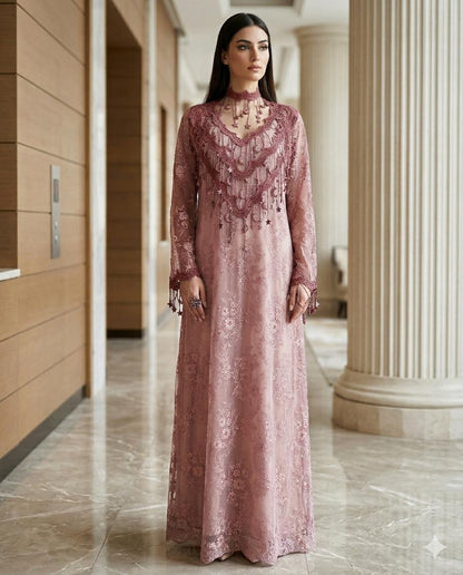 Woman in a long, Dusty Pink Floral High-Neck Lace Kaftan Perfect for Eid, Ramadan, Weddings, Henna, and Parties standing in an elegant interior setting.