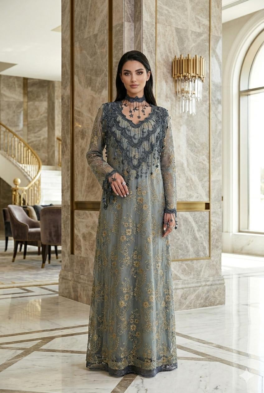 Woman in a long, Slate Blue Floral High-Neck Lace Kaftan Perfect for Eid, Ramadan, Weddings, Henna, and Parties standing in an elegant interior setting