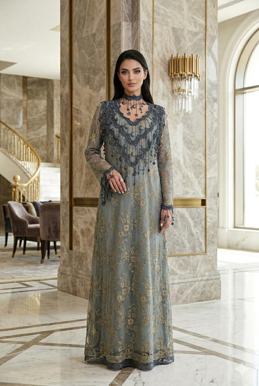 Woman in a long, Slate Blue Floral High-Neck Lace Kaftan Perfect for Eid, Ramadan, Weddings, Henna, and Parties standing in an elegant interior setting