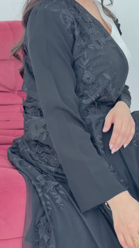 A luxury premium black abaya, the abaya is made of nida fabric with lace designs. Perfect for formal events.