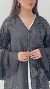A luxurious black abaya with chiffon and texture of Black floral lace. This abaya is perfect for evening outings and occasions.