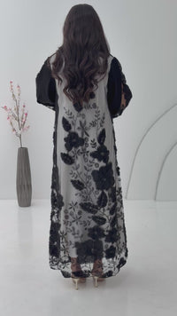 A black abaya, this luxurious piece is made of lace/dantel with a premium Nida fabric, this abaya is perfect for engagement and daytime weddings.