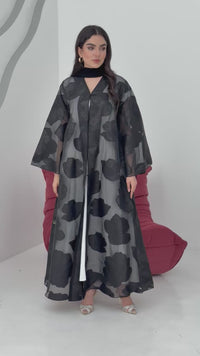 A black floral abaya crafted from organza and lace fabric. Perfect choice for events.