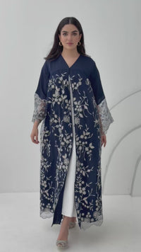 A luxurious and romantic navy blue abaya with floral lace and Nida fabric, that is perfect for engagements, henna parties and weddings.