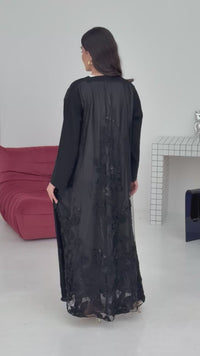 A black floral abaya with embroidery at the back, the abaya is perfect for evening galas, dinner outings.