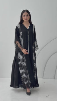 Woman wearing a Black Floral Lace Panel Abaya with a matching sheila against a white background